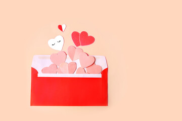 red envelope with pink and red hearts.
