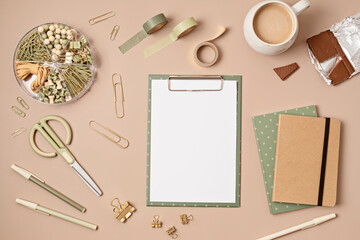 Mockup of clipboard and office supplies with white page copy space for your text. Flat lay, top view photo mock up