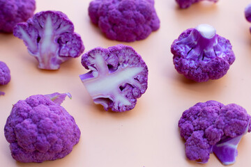 Purple cauliflower on old rose color background.