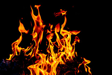 Flames of fire isolated on a black background, close up, abstract