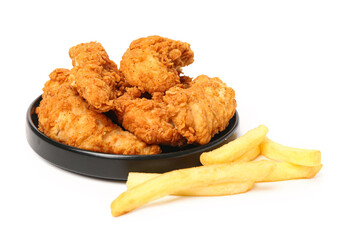 Plate with tasty nuggets and french fries on white background