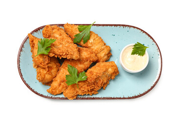 Plate of tasty nuggets with parsley and sauce on white background