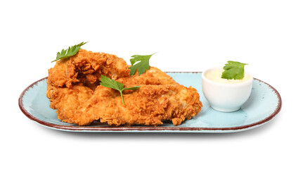 Plate of tasty nuggets with parsley and sauce on white background