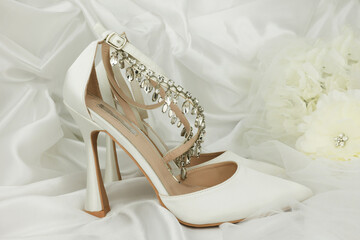 high heel shoes  on a whiite silk background