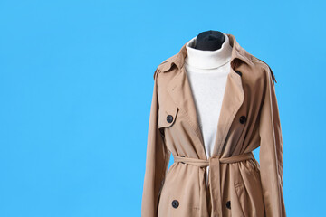 Mannequin with stylish clothes on blue background, closeup