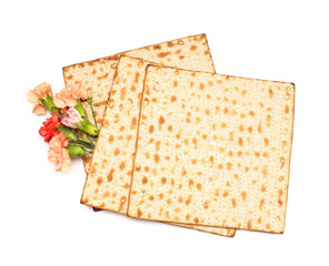 Jewish flatbread matza for Passover and beautiful carnation flowers on white background