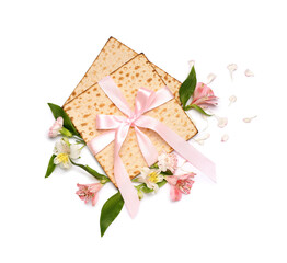 Composition with Jewish flatbread matza for Passover and beautiful flowers on white background
