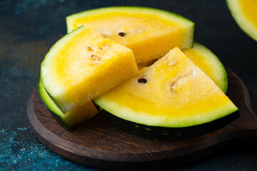 Cut yellow watermelon on table. Fresh summer food. Healthy nutrition