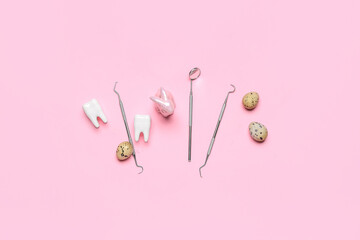 Dental tools with plastic teeth, Easter rabbit and eggs on pink background