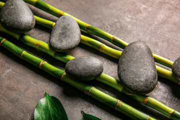 Obraz na płótnie Canvas Spa stones and bamboo on dark background