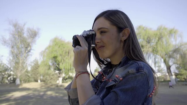 Girl captures the beauty of the sunset in the park through her passion for photography.