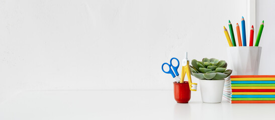 Creative desk, learnign workspace full of school accessories. Learning workspace.	