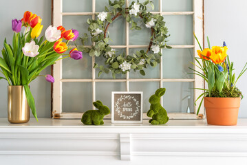 Hello Spring sign with tulips on the mantel