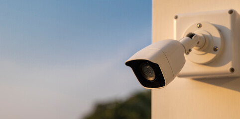 CCTV camera on blue sky background. Equipment for security systems and have copy space, close up