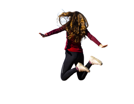 Long-haired girl jumping for joy isolated on transparent background; long flowing hair of beautiful model isolated; healthy long hair