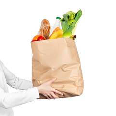 Food delivery, online grocery shopping or donation concept. Store shopping woman or courier holds a paper bag filled with groceries isolated on white background. Banner.