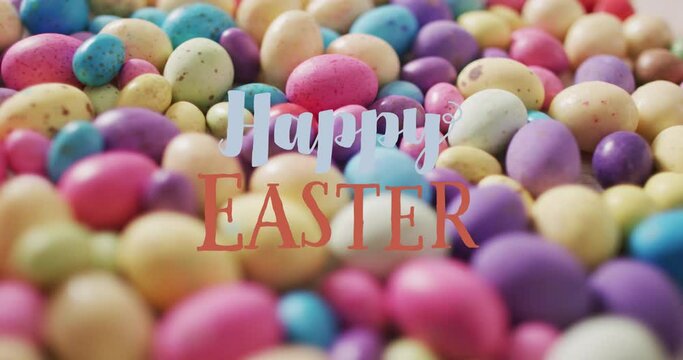 Animation of happy easter over colorful easter eggs