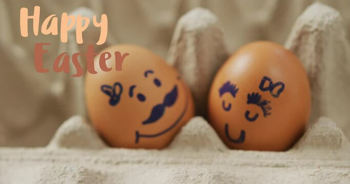 Animation of happy easter over eggs with faces in egg cardboard