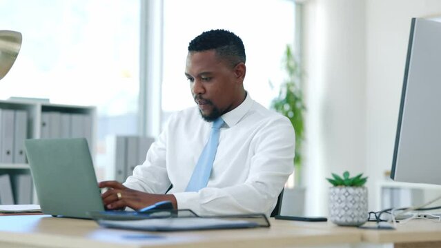 Serious, laptop and search with black man in office for connection, email and online proposal. Technology, corporate and professional with employee typing at desk for expert, digital and browsing