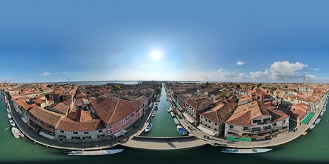 360 aerial photo taken with drone of canals in Murano, Venice, Italy on a bright sunny day