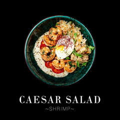Top view of seafood Caesar Salad served in bowl isolated on black background. Ready advertising banner with text and copy space. Italian salad with roasted shrimps, poached egg, lettuce and croutons