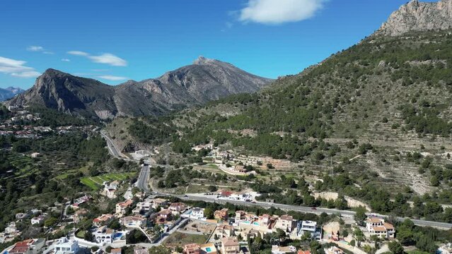 A journey through Calpe: aerial view of the N-332 highway and the cityscape.A lot of cars driving.Coast Costa Blanca.Calp, Alicante, Spain