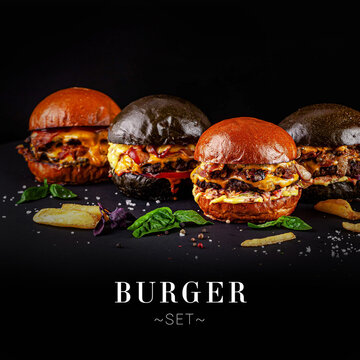 Set of different burgers with white and black bun. Set with French fries and basil leaves. Cheesy Meat hamburger with lettuce and tomato rings isolated on black background. menu ready banner
