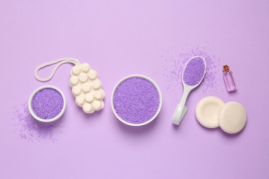 Flat lay composition with aromatic sea salt on purple background