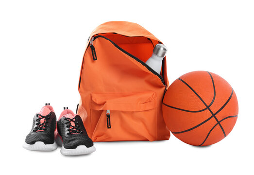Backpack with sports equipment on white background