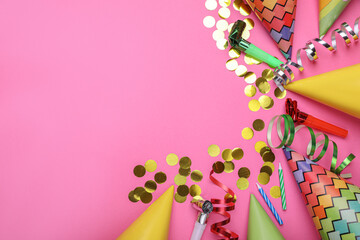 Flat lay composition with party items on pink background, space for text. Birthday celebration