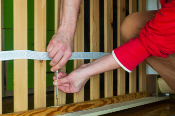 Carpenter twist the screw with a screwdriver