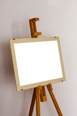 An empty horizontal picture with a Passpart on an easel. Place for inserting the image.