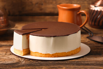 Delicious birds milk cake on wooden table