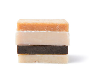 Stack of different soap bars isolated on white background