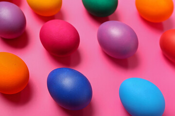 Colorful Easter eggs on pink background