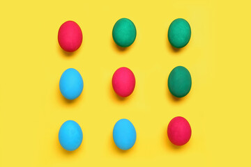 Painted Easter eggs on yellow background