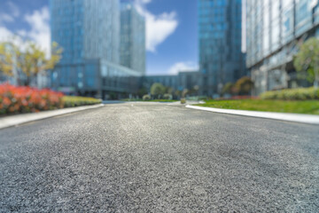 city empty traffic road with cityscape in background