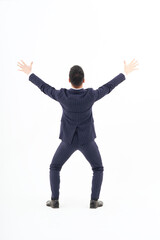 A man in a suit expressing joy