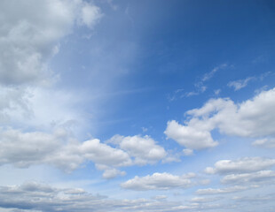 Naklejka na ściany i meble Panorama Blue sky and white clouds. Fluffy cloud in the blue sky background