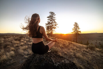 Beautiful young woman practice yoga at sunset time on nature outdoors. Healthy lifestyle concept.