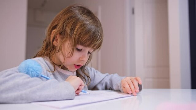 Smart Young Caucasian Girl Preshooler Doing Math Homework Counting Numbers with Her Fingers