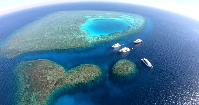 Aerial Drone Shot for Abu Nuhas Coral Reef Dive Site in `the Red Sea of Egypt. The reef is a navigation hazard because it projects into the shipping channel, as evidenced by seven shipwrecks.