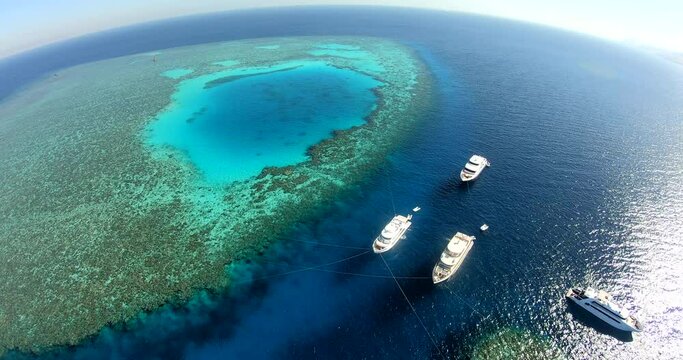 Aerial Drone Shot for Abu Nuhas Coral Reef Dive Site in `the Red Sea of Egypt. The reef is a navigation hazard because it projects into the shipping channel, as evidenced by seven shipwrecks.
