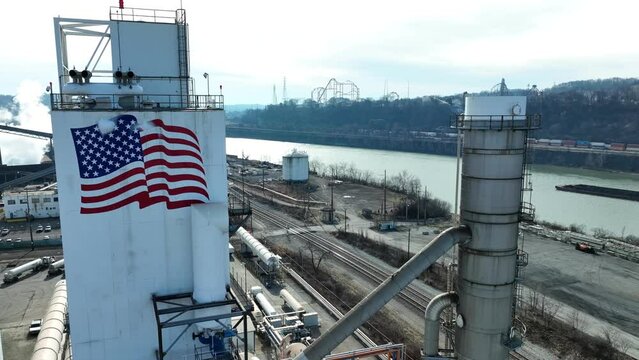 Aerial shot of American flag at US Steel Plant, Edgar Thomson Plant. Braddock Pennsylvania manufacturing factory of steel.