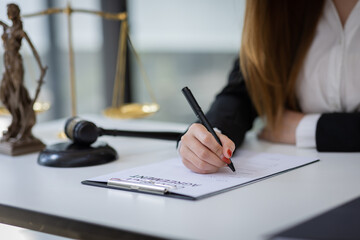 female intelligent law attorney lawyers working at the law firms. Judge gavel with scales of...