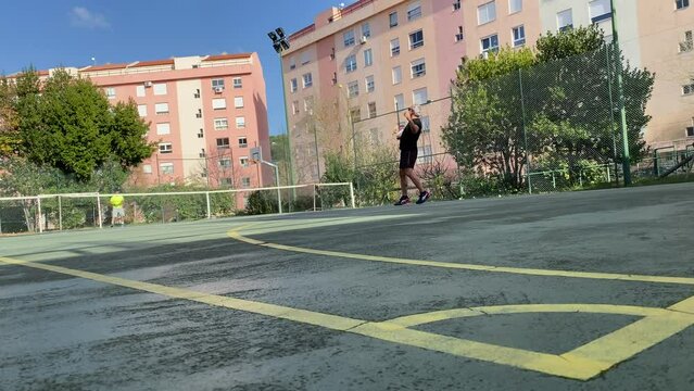 tennis game, sports player man contestant hitting racket on ball pass through net to each other at court during championship