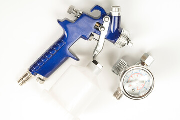 blue color paint gun on a white background close-up