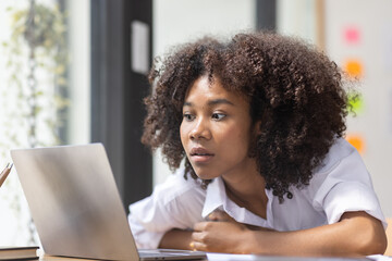 Portrait of tired young business african american woman work with documents tax laptop computer in office. Sad, unhappy, Worried, Depression, or employee life stress concept	
