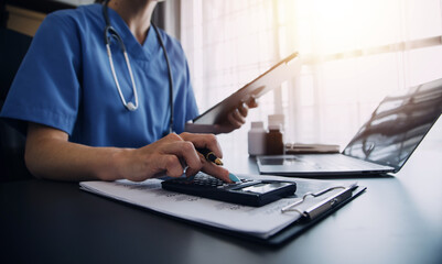Fototapeta premium Medicine doctor working with digital medical interface icons on the hospital background, healthcare and Medical technology and network concept.