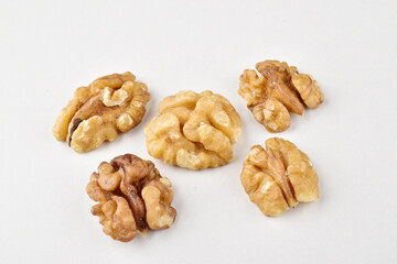 Ripe walnut without shell on white background